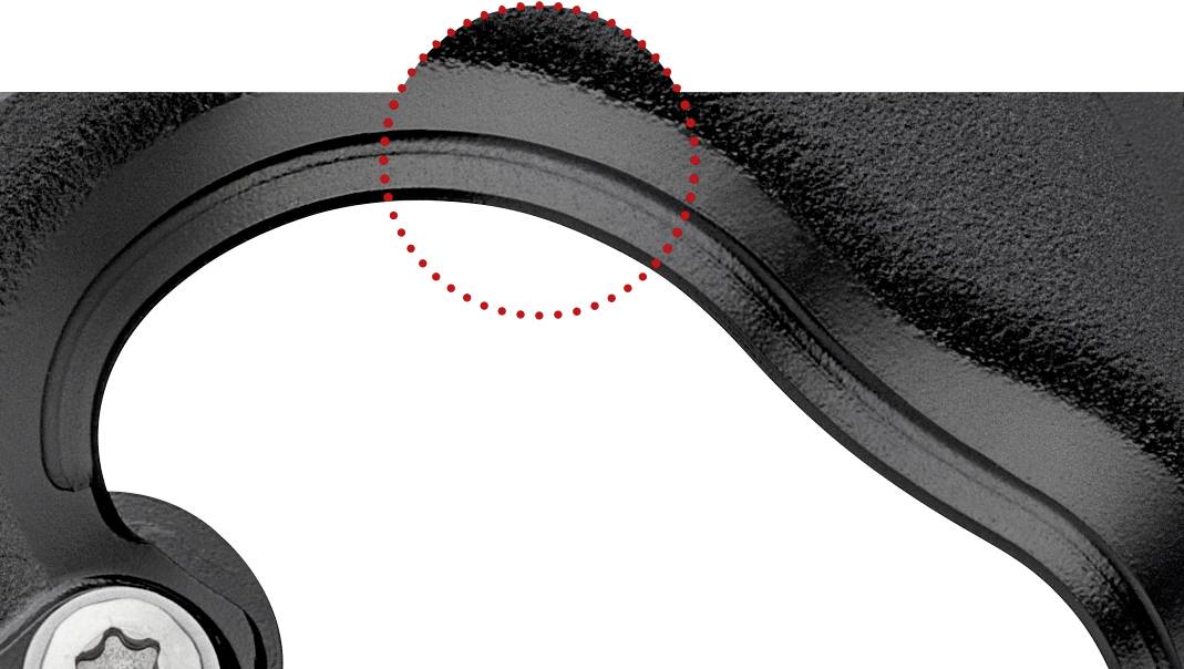 Nahaufnahme eines Bremsgriffs mit roter, gestrichelter Linie, die auf einen spezifischen Bereich zur Hervorhebung eines Details zeigt.