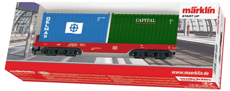 Modelleisenbahn in Verpackung, mit einem Doppelcontainerwagen mit "DELMAS" auf einem blauen Container und "CAPITAL" auf einem grünen Container.