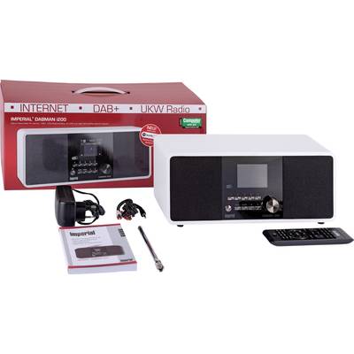 'Radio Imperial Dabman i200 weiß' mit Zubehör, einschließlich Fernbedienung, Netzteil, Antenne und Bedienungsanleitung. Verpackung im Hintergrund.