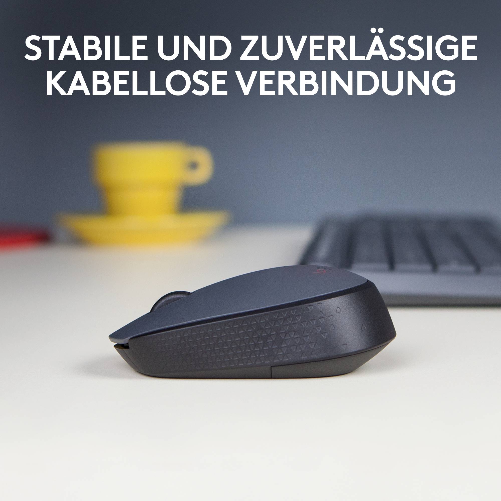 Kompakte kabellose Maus auf Schreibtisch, gelbe Tasse im Hintergrund. Text oben: 'Stabile und zuverlässige kabellose Verbindung'.