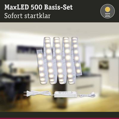 'MaxLED 500 Basis-Set' mit LED-Leuchten, sofort einsatzbereit. Hintergrund zeigt unscharfes Wohnzimmer, Schrift sagt 'warm white'.