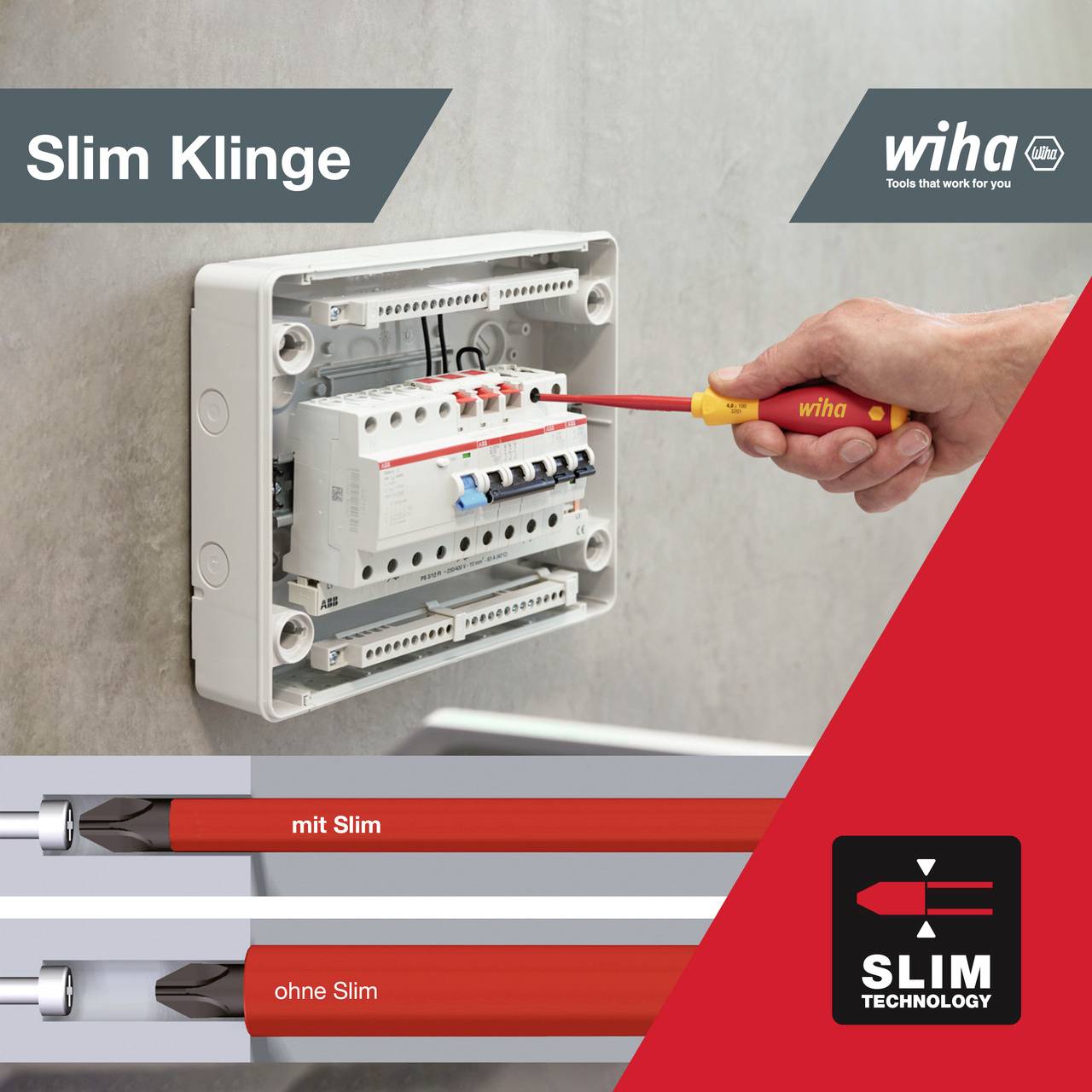 'Eine Hand verwendet einen roten Schraubendreher, um an einer geöffneten elektrischen Schalttafel zu arbeiten. Wiha Slim Klinge.'