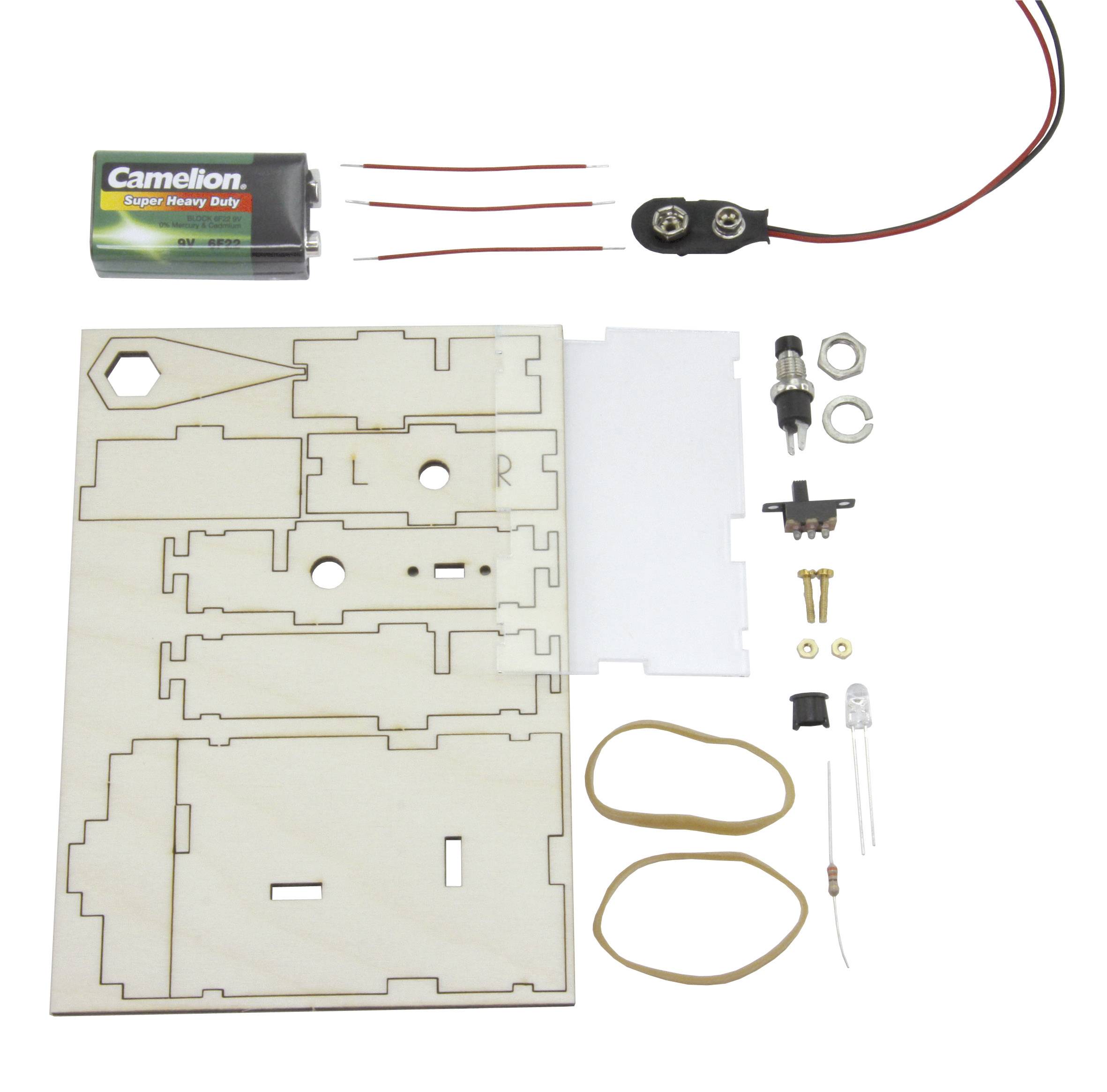 'Bausatz für ein elektronisches Projekt: Batterie, Schalter, Drähte, LED, Gummibänder und Holzteile für Zusammenbau.'