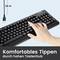 Schwarze Computer-Tastatur mit Hand auf einer Taste. Text im Bild: 'Komfortables Tippen durch hohen Tastenhub'. Kabel: 1,8 m.