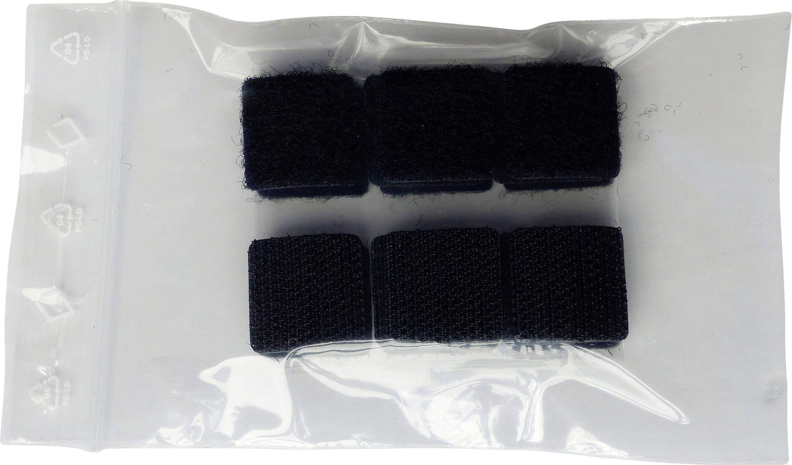 Eine durchsichtige Plastiktüte enthält sechs schwarze, quadratische Klettverschluss-Stücke.