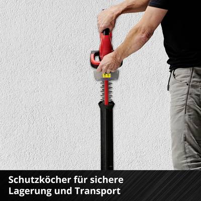 Person hält eine rote Säge mit Schutzabdeckung. Text unten: 'Schutzköcher für sichere Lagerung und Transport'.