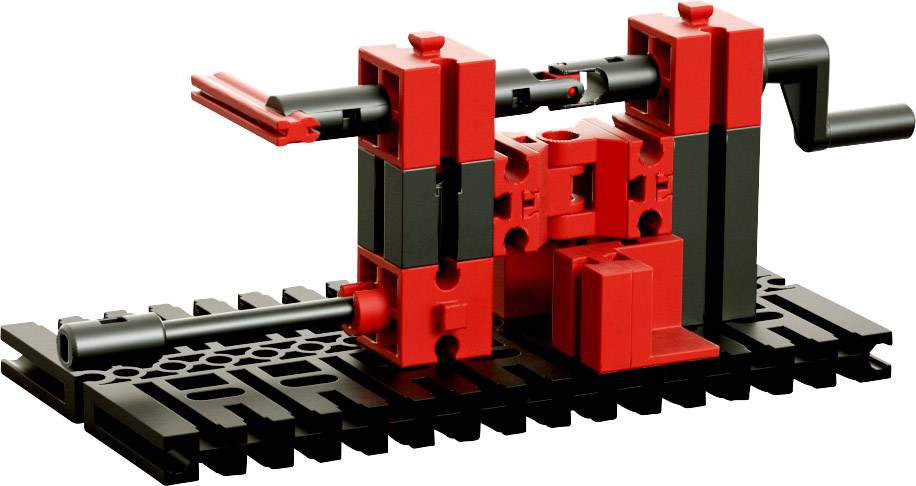 Ein schwarz-rotes LEGO-Modell auf einer Basis, das eine Art mechanische Vorrichtung oder Maschine darstellt.