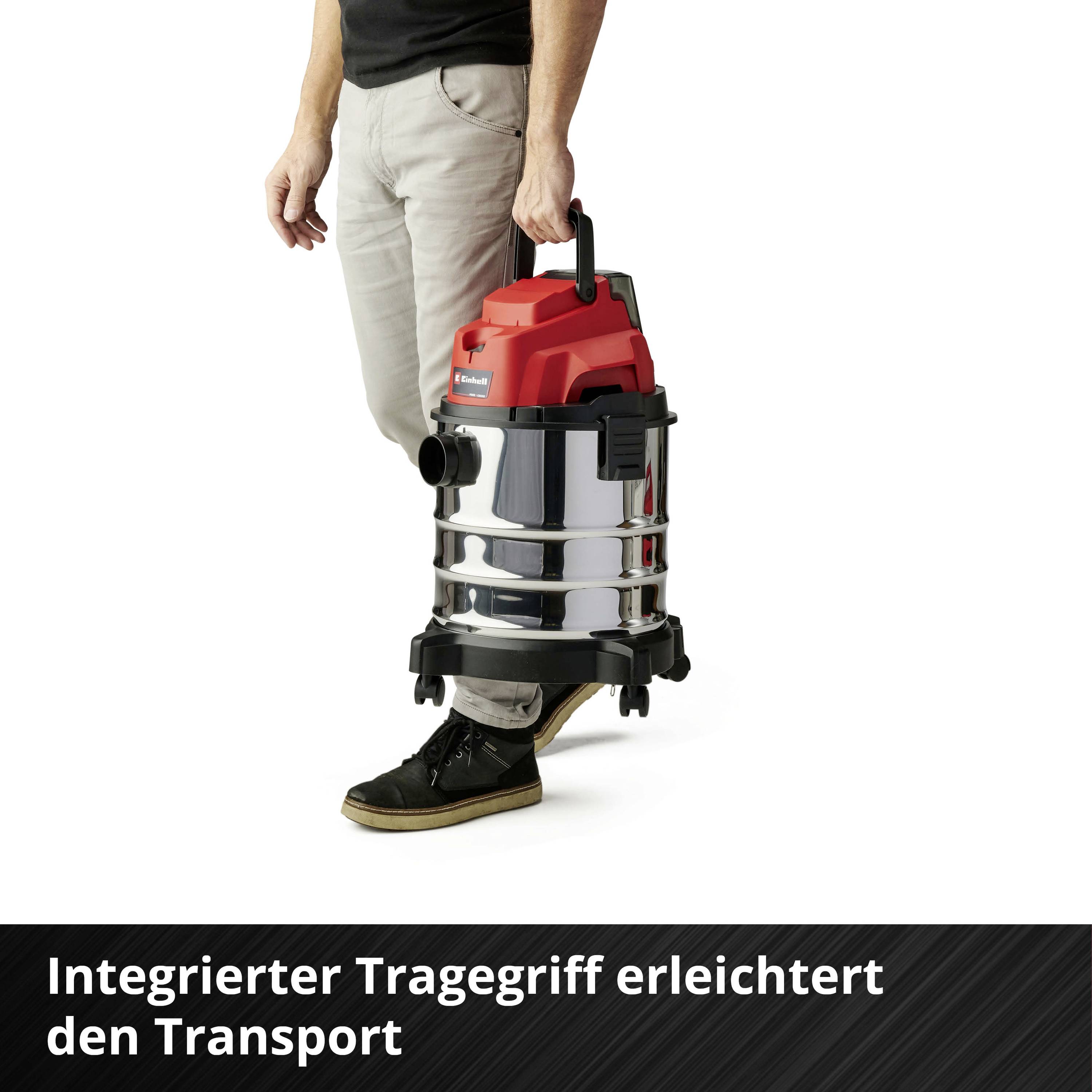 Person hält einen silbernen und roten Staubsauger mit integriertem Tragegriff. Text: 'Integrierter Tragegriff erleichtert den Transport'.