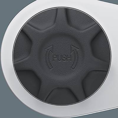 Ein kreisförmiger schwarzer Knopf mit der Beschriftung ‚PUSH', versehen mit Pfeilen, die einen Drehvorgang andeuten, vor einem hellgrauen Hintergrund.