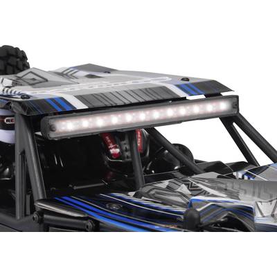 Ein ferngesteuertes Auto im Nahbereich mit schwarz-blauem Design und LED-Lichtleiste auf dem Dach.