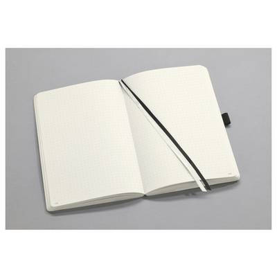Offenes Notizbuch mit gepunkteten Seiten und schwarzem Lesezeichen auf einer grauen Oberfläche.