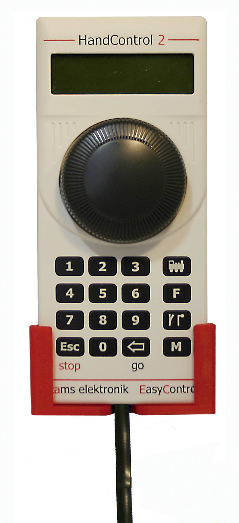 Handgehaltene Fernbedienung mit der Bezeichnung 'HandControl 2', ausgestattet mit einem großen zentralen Drehregler, Zifferntastatur und Start-/Stopp-Tasten.