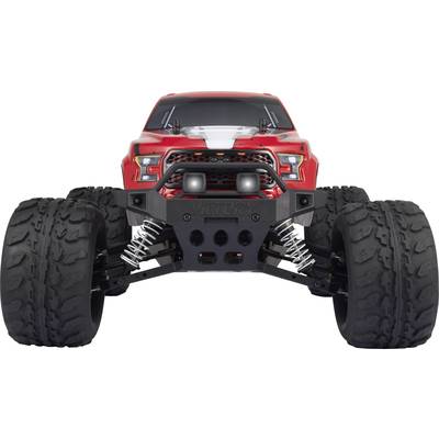 Ein roter ferngesteuerter Monstertruck mit dicken Offroad-Reifen und Federung. Vorderansicht zeigt robuste Bauweise und LED-Leuchten.