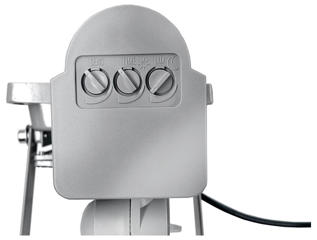 Ein grauer Bewegungsmelder mit drei einstellbaren Drehreglern, beschriftet mit "SENS", "TIME" und "LUX". Das Design ist kompakt und funktional.