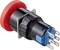 Ein roter runder Knopf mit Metallanschlüssen an der Rückseite, dient zur elektrischen Verbindung oder Steuerung in technischen Geräten.