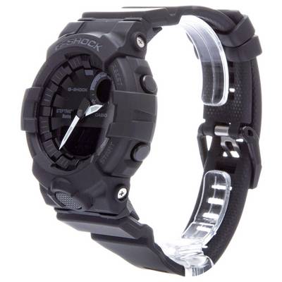 Schwarze G-Shock-Uhr mit robustem Design, runder digitaler Anzeige und seitlichen Knöpfen. Armband mit Metallschnalle.