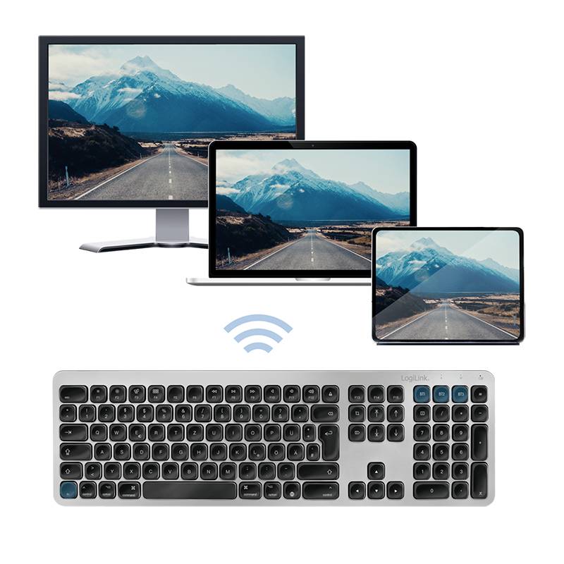 'Kabellose Tastatur verbunden mit drei Bildschirmen, die denselben Bergstraßen-Hintergrund darstellen. Vielseitige Konnektivität.'