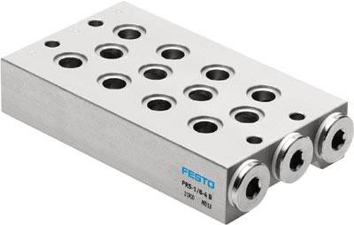 Metallblock mit mehreren runden Aussparungen, Beschriftung 'Festo' an der Seite. Möglicherweise ein Ventilblock oder Verbindungsteil.