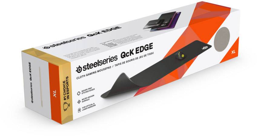 Die Abbildung zeigt die Verpackung eines SteelSeries QcK Edge XL Gaming-Mauspads. Auf der Verpackung sind Produktbilder und Logos zu sehen.
