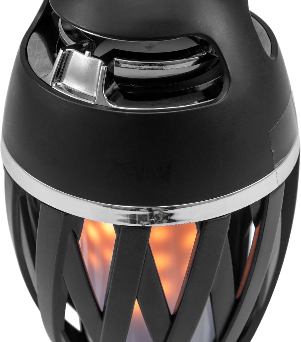 Eine schwarze, moderne Tischlampe mit Gitterdesign, die ein warmes, flammenähnliches Licht ausstrahlt.