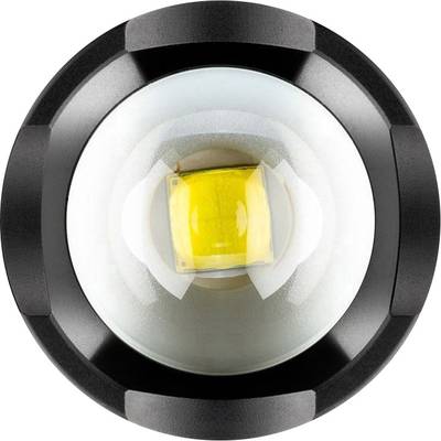 Eine Nahaufnahme einer LED-Lampe mit einer kreisförmigen Linse und einem gelben Leuchtmittel in der Mitte, von oben betrachtet.