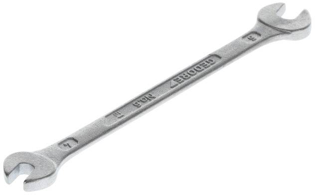 Ein silberner Doppelmaulschlüssel mit den Größen 6 und 7 mm, auf dem der Markenname 'GEDORE' eingeprägt ist.