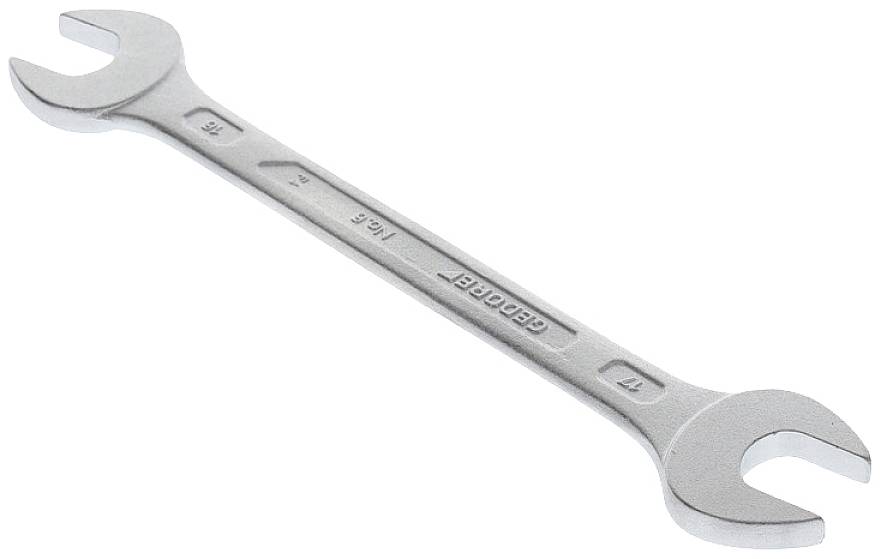 Ein silberner Maulschlüssel mit offenen Enden unterschiedlicher Größe, verwendet zum Anziehen oder Lösen von Schrauben und Muttern.