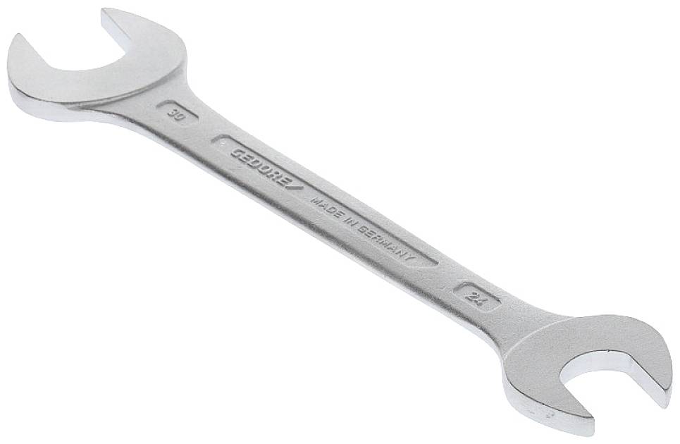 Ein silberner Doppelmaulschlüssel liegt diagonal. Links ist die Größe 30 mm und rechts 32 mm auf dem Werkzeug eingraviert.
