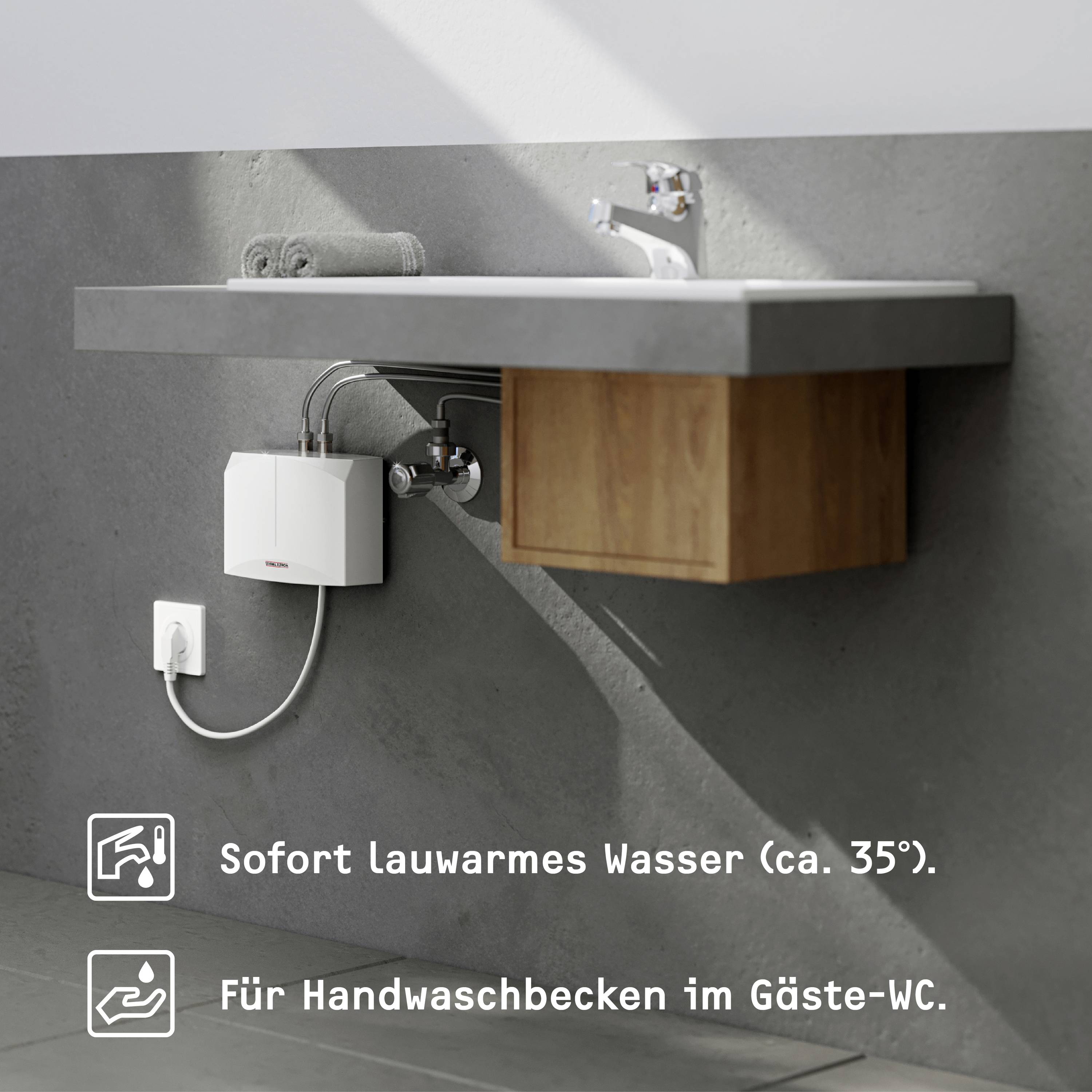 Waschtisch mit Wasserhahn und kleinem Wasserboiler an der Wand. Text auf Deutsch: 'Sofort lauwarmes Wasser (ca. 35 °)' und 'Für Handwaschbecken im Gäste-WC'.