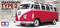Ein roter Volkswagen Type 2 Modellauto im Maßstab 1:10, präsentiert von Tamiya. Hintergrund zeigt einen grauen, unscharfen Bus.