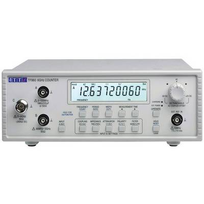 Frequenzzähler auf einem Tisch zeigt '12.63720060' an. Details zur Bedienung und Einstellungen auf der Frontplatte sichtbar.