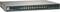 Ein grauer Netzwerk-Switch mit 24 Ethernet-Ports auf der Vorderseite. Links sind LEDs und eine Stromversorgung sichtbar.