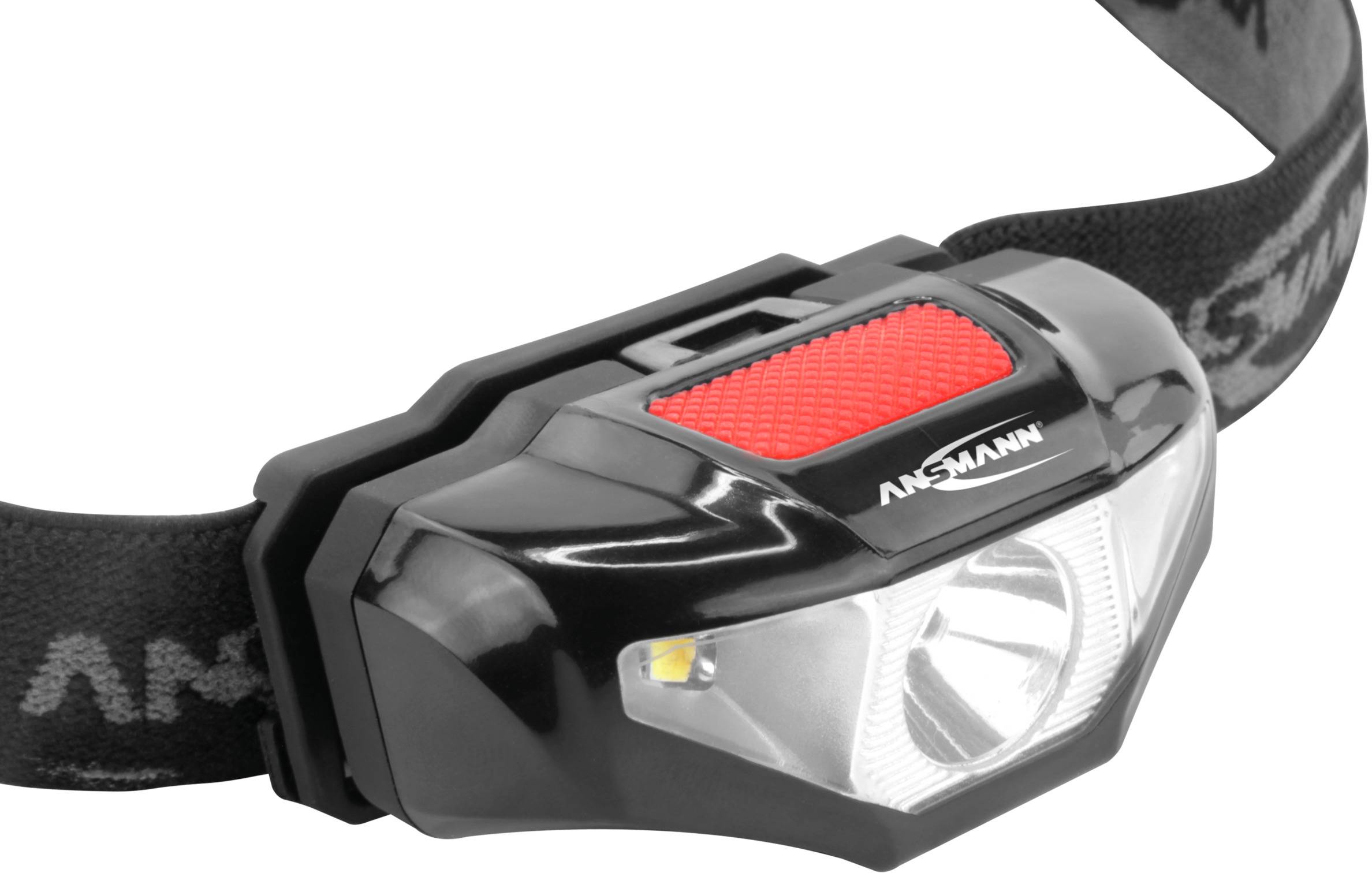 Schwarze Stirnlampe mit rotem Schalter, elastischem Kopfband und leuchtstarker LED, geeignet für Outdoor-Aktivitäten.