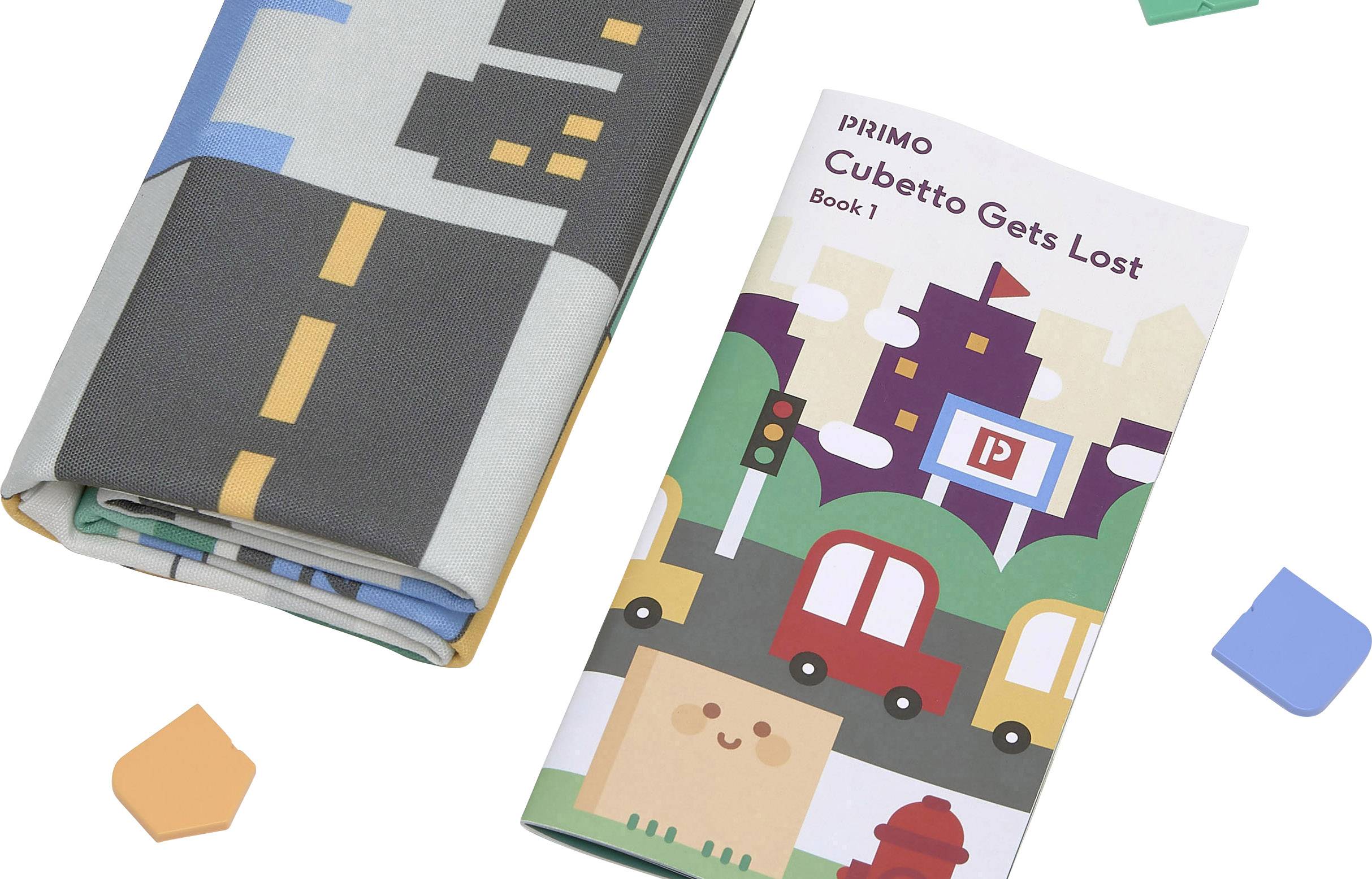 'Cubetto Gets Lost' Buch und Stadtplan auf Papier mit bunten Blöcken.