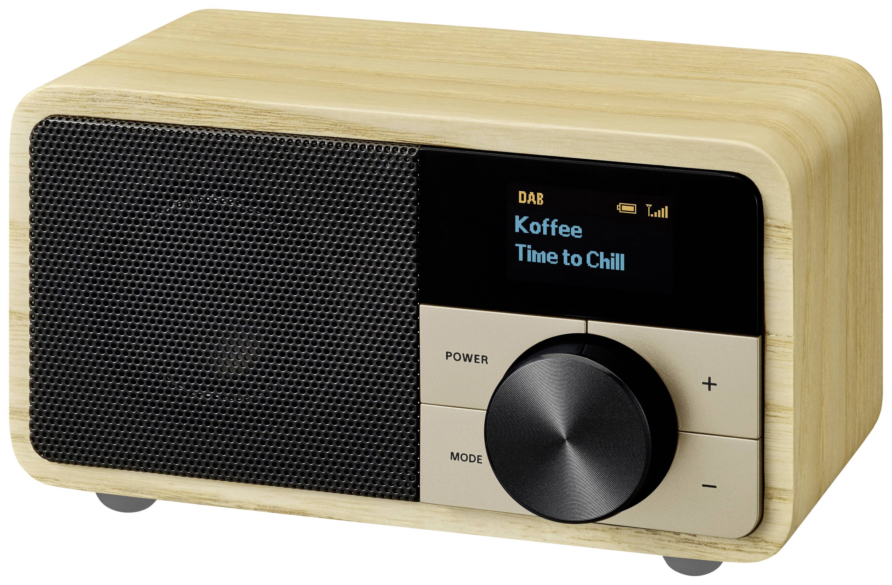 Ein Kompaktradio aus Holz mit Digitalanzeige, auf der 'DAB' und 'Koffee Time to Chill' steht. Der Lautstärkeregler ist prominent.