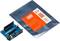 Arduino MKR2UNO Adapter neben grauem Beutel mit orangefarbenem Etikett und Spezifikationen. Adapter zur Verbindung von Arduino-Boards.