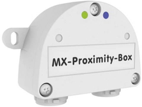 Ein weißes Gerät mit der Aufschrift 'MX-Proximity-Box', das zwei bunte LEDs und Schrauben auf der Vorderseite hat.