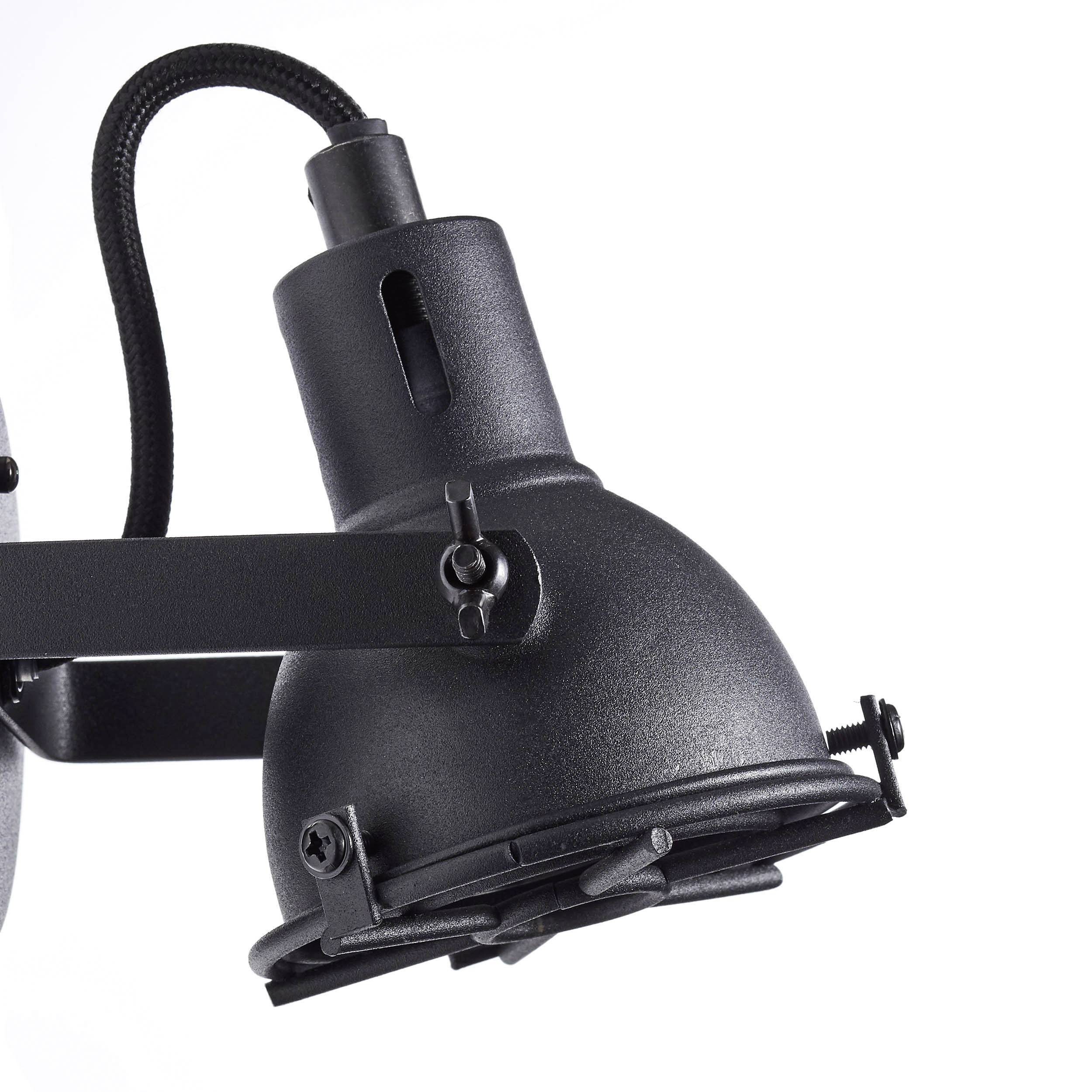Eine schwarze, industrielle Wandleuchte mit verstellbarem Arm und Kabel, geeignet für moderne Inneneinrichtungen.