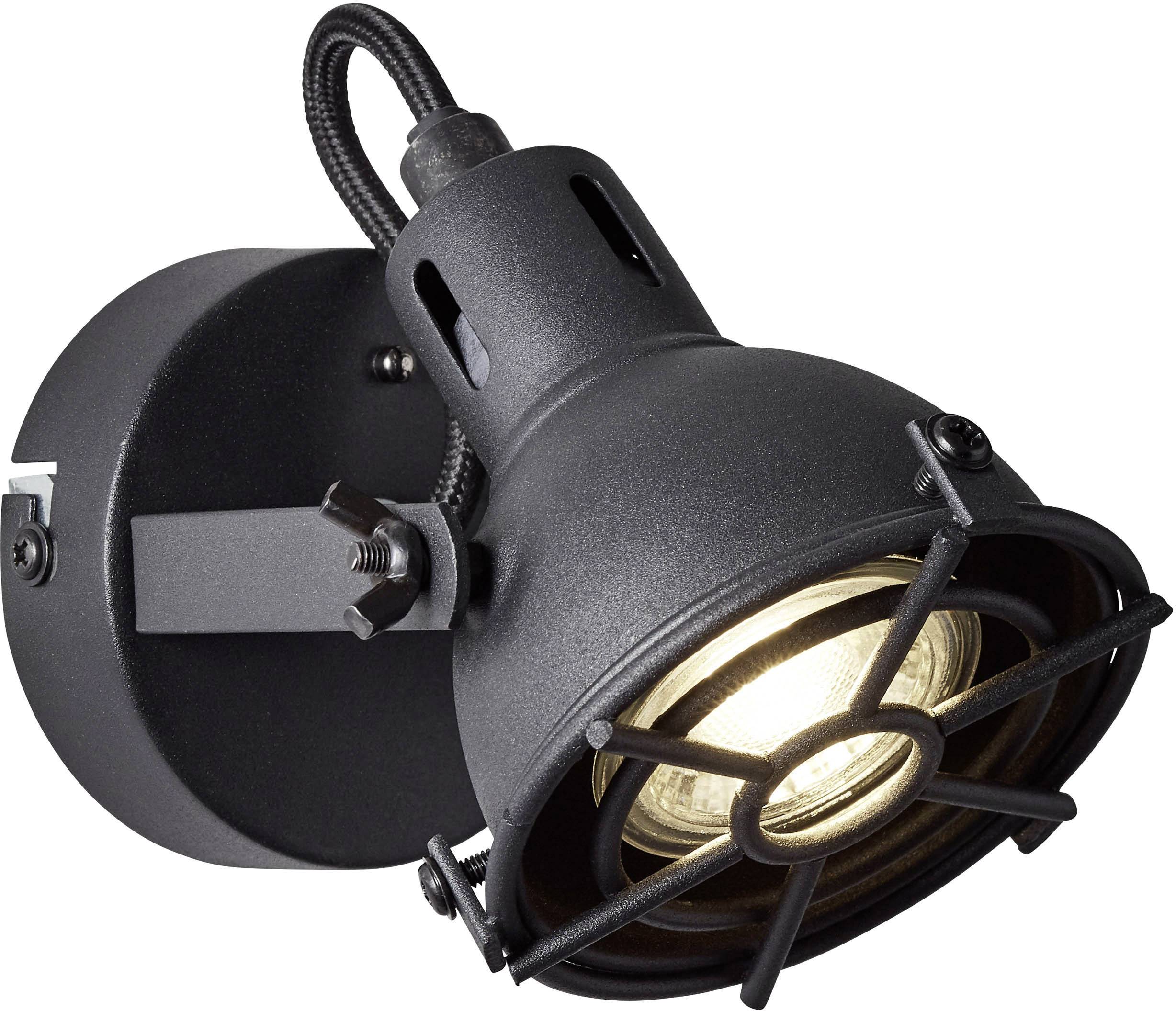 Eine schwarze Wandlampe mit einem industriellen Design, erleuchtet.