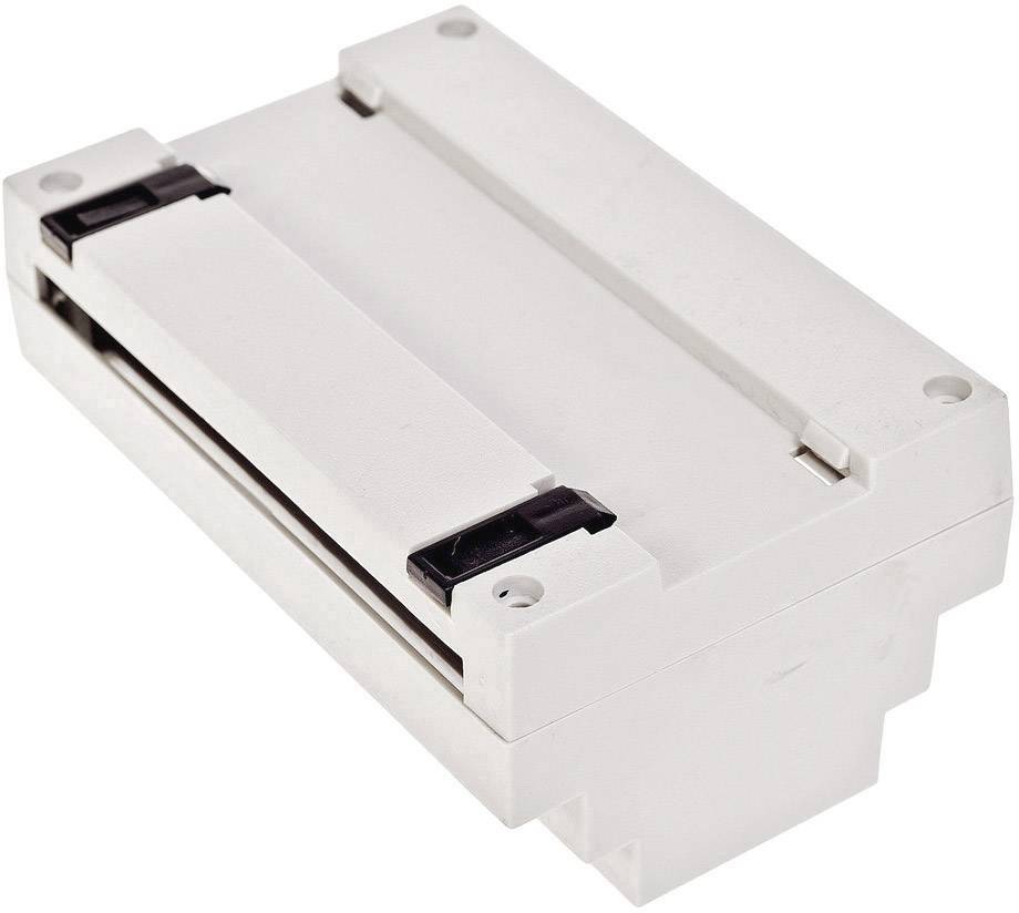 Ein rechteckiges, weißes elektronisches Bauteil mit schwarzen Klammern an beiden Enden. Es scheint Teil eines elektrischen Systems zu sein.