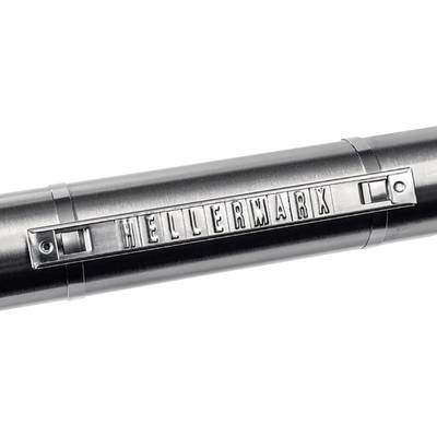 Ein metallischer Stempel mit der Aufschrift 'HELLERMARK' in erhabenen Buchstaben auf einem runden zylindrischen Objekt.