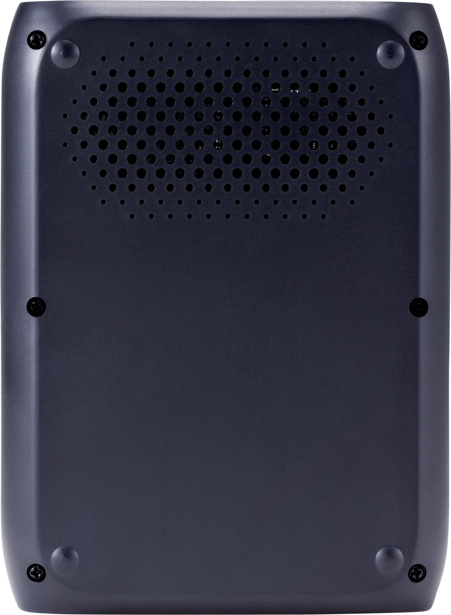 Schwarzes rechteckiges Gerät, vermutlich ein Router oder Lautsprecher, mit sichtbaren Schrauben und Lüftungsschlitzen oben.