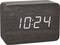 Digitale Uhr aus Holzoptik zeigt die Uhrzeit '10:24' an.