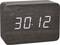 Eine digitale Uhr zeigt die ungewöhnliche Zeit '30:12' an, mit einem dunklen, holzähnlichen Gehäuse.