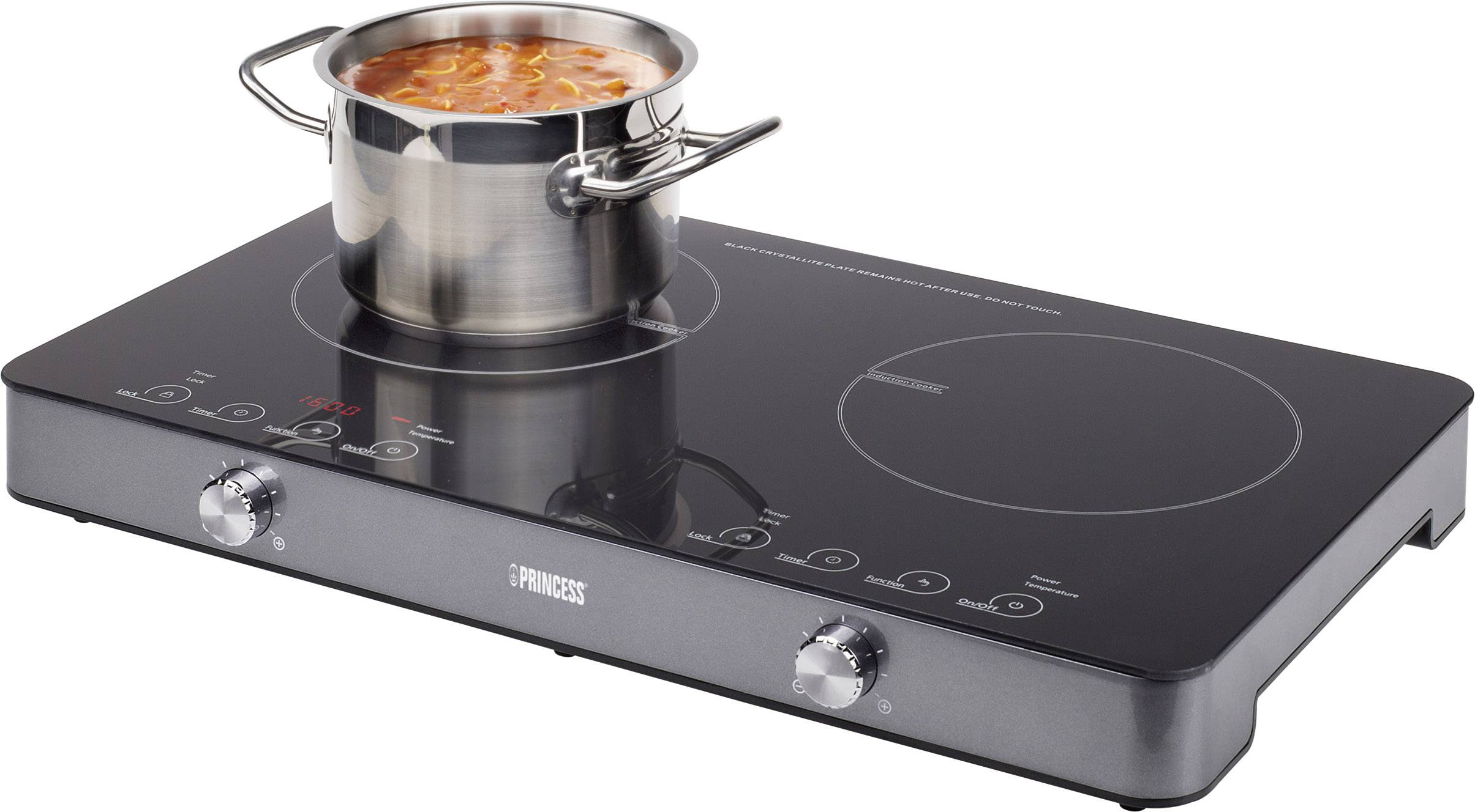 Ein Topf mit Suppe auf einem schwarzen Induktionskochfeld. Zwei Bedienknöpfe und ein digitales Display befinden sich vorne.