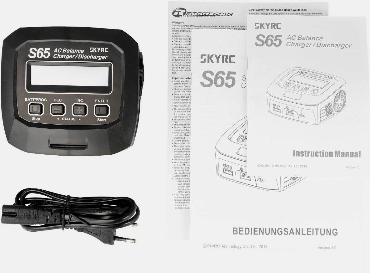 'Ladegerät S65 mit Bedienungsanleitung und Netzkabel. Geeignet zum Laden und Entladen von Batterien. Anleitung in mehreren Sprachen.'