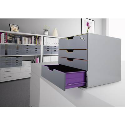 Ein Büro mit grauen Schubladenboxen auf einem weißen Tisch. Eine Schublade ist geöffnet, darin befinden sich Bücher und Büromaterial.