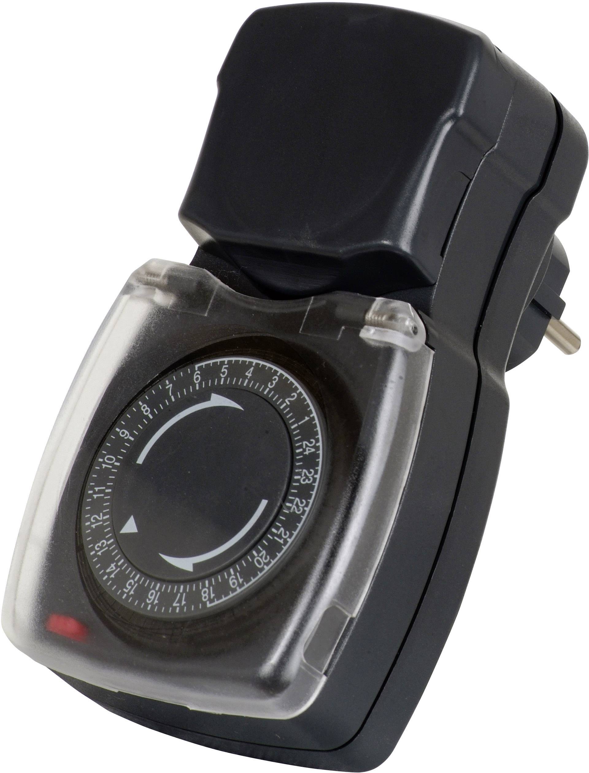 Eine schwarze analoge Zeitschaltuhr zur Steuerung von elektrischen Geräten. Sie hat ein rundes Zifferblatt mit eine Zeitanzeige.