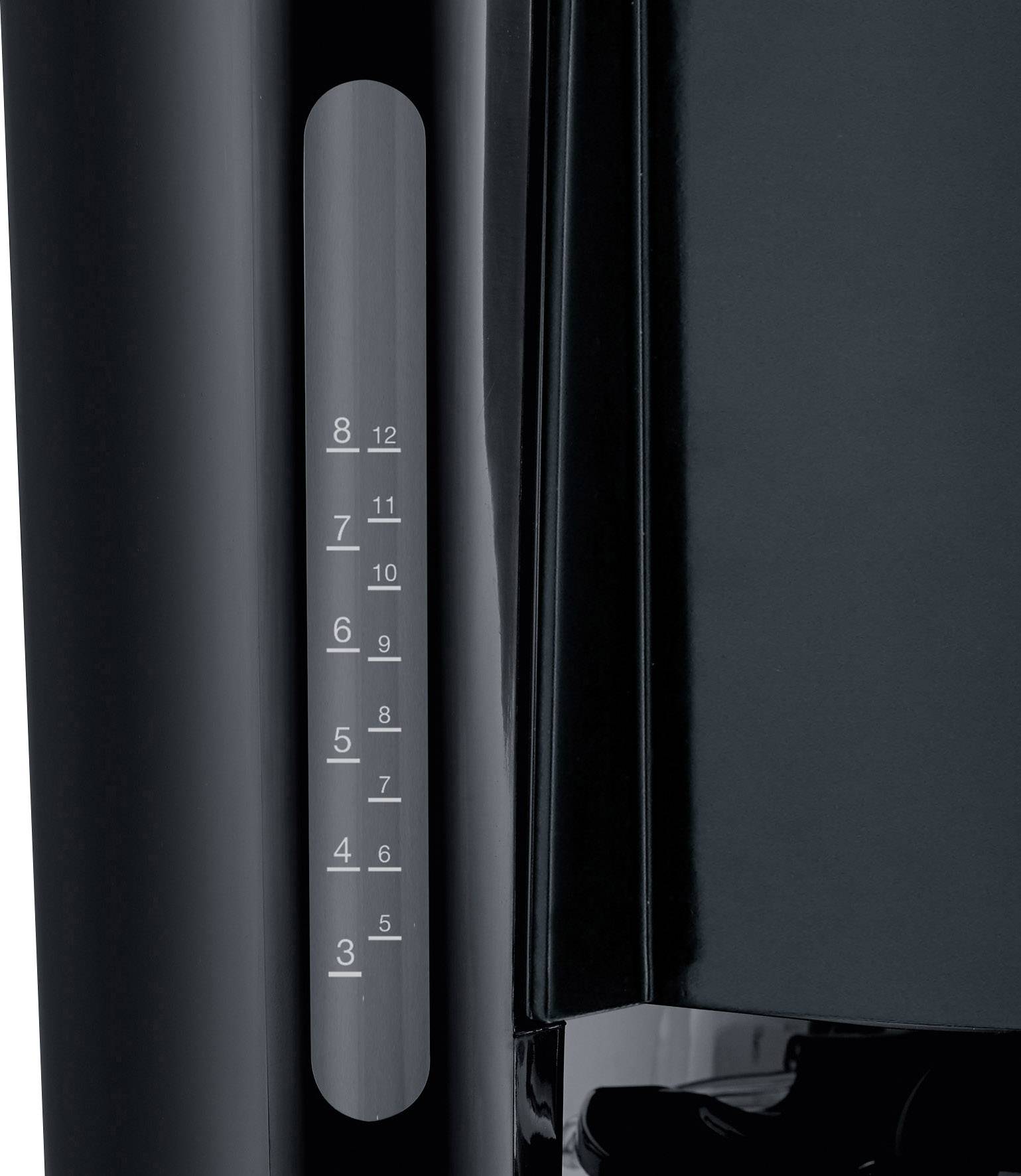 Nahaufnahme eines schwarzen Geräts mit einem Wasserstandsanzeiger an der Seite, der Markierungen von 3 bis 12 zeigt.