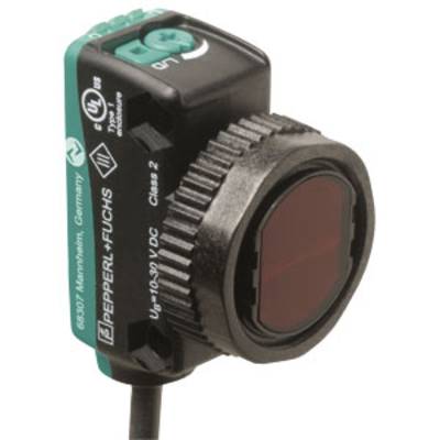 Ein rechteckiger Sensor mit einem runden, schwarzen Objektiv; Aufschrift: 'Pepperl + Fuchs'. Eignung für Spannungen von 10-30V DC.